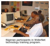 Photo of two Nigerians working on the WiderNet Project.