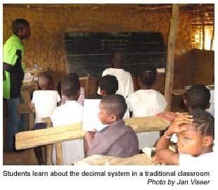 Students learn about the decimal system in a traditional classroom. Photo by Jan Visser