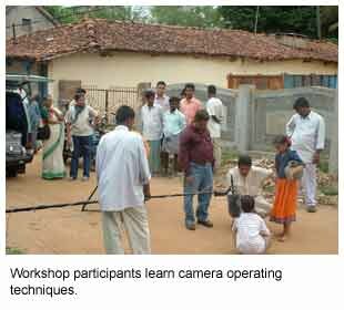 Image of Workshop participants learning camera operating techniques.