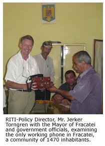  RITI-policy Director, Mr. Jerker with Mayor and government officials, examining the only working phone in Fracatei community of 1470 inhabitants.