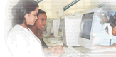 image of two girls from Brazil working on a computer