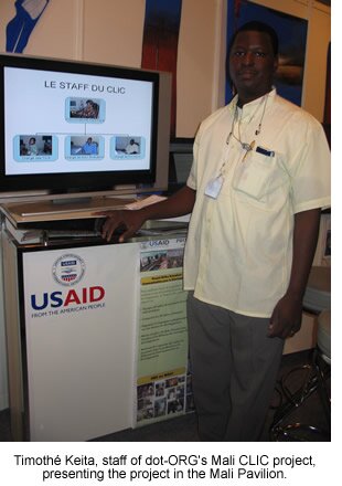 Timothe Keita, staff of dot-ORG's Mali CLIC project, standing by the Mali CLIC project display in th