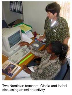 two teachers looking at a computer screen
